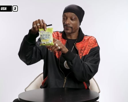 Snoop Dogg considers Scampi Fries in and episode of Snack Wars on LadBible’s YouTube channel.