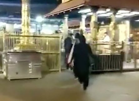 Two women enter the Sabarimala temple in Kerala, India