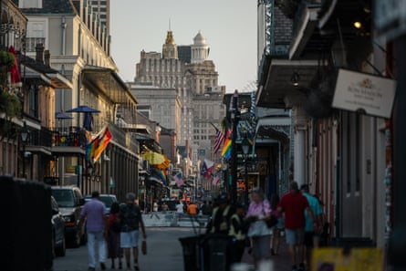 people walking on main city street outside of businesses