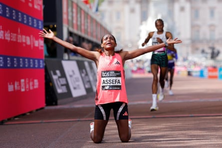 Ethiopia’s Tigst Assefa celebrates her world record time after winning the London Marathon