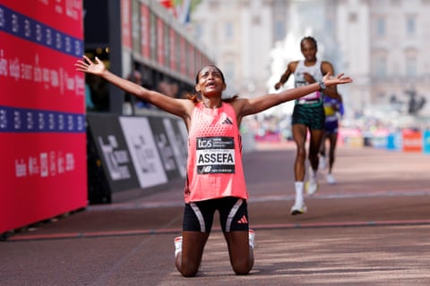 Ethiopia’s Tigst Assefa celebrates her world record time after winning the London Marathon