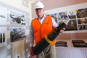 Australian Prime Minister Scott Morrison holds an ammunition shell during a visit to Rheinmetall NIOA Munition factory in Maryborough, QLD, Thursday, January 21, 2021.