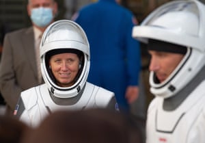 NASA astronaut Shannon Walker and Mike Hopkins talk to the family as they exit the Neil A. Armstrong Operations and Checkout Building.