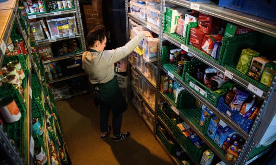 A volunteer at Wandsworth food bank, south London: ‘Mumford’s opinions on economic intervention align him with the left’