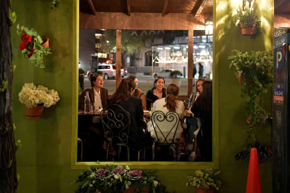 People enjoy an evening out in Greenwich Village in April.