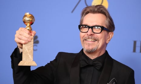 Gary Oldman with his Golden Globe award for best actor in Darkest Hour.