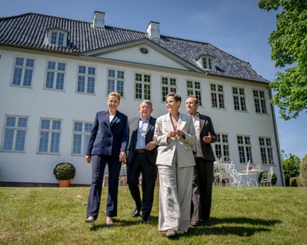 Incoming prime minister Mette Frederiksen of the Social Democrats, Lars Løkke Rasmussen, leader of the Moderates, Pia Olsen Dyhr, leader of the Green Left (SF) and Martin Lidegaard, leader of the Social Liberal party, walk in the garden at Marienborg, the Danish prime minister's residence.
