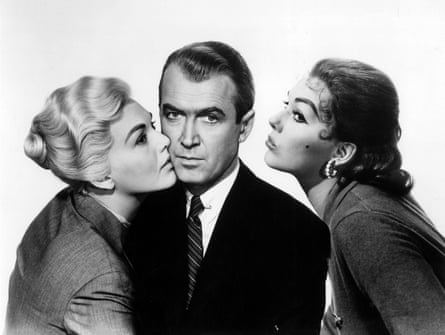 James Stewart flanked by two Kim Novaks in her roles as Madeleine and Judy in Vertigo