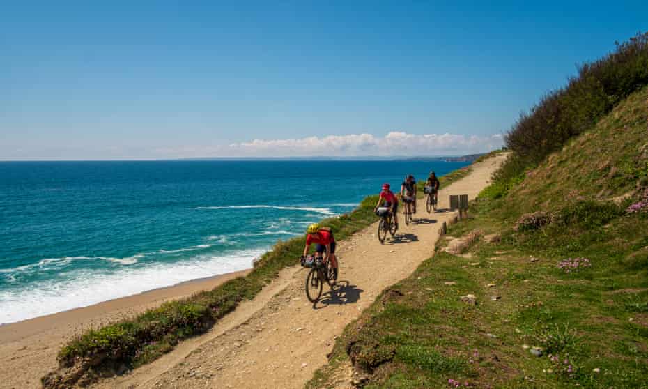 The sandy track descends to Loe Bar, where swimming is prohibited due to dangerous currents.