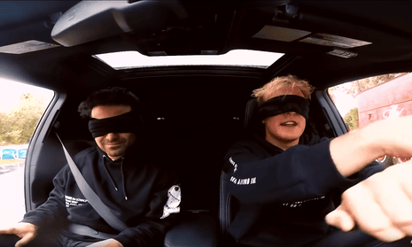 YouTubers George Janko (left) and Jake Paul (R) attempt to drive while blindfolded as part of the Bird Box challenge, based on the Netflix movie Bird Box. Netflix has expressly disclaimed the challenge.