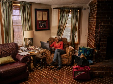Kara Brewer Boyd works in the living room of their home in Baskerville, Virginia. ‘Some days I don’t leave this chair,’ said Boyd, the event and program coordinator for the National Black Farmer’s Association founded by John.
