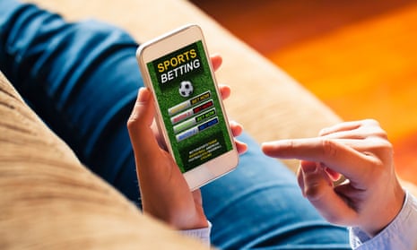 Mobile phone with sports betting website app in the screen