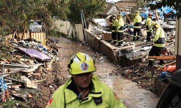 Fire rescue personnel work at the scene following the explosion and collapse of a townhouse in Whalan, in Sydney.