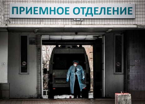 An ambulance drives into a hospital in Moscow, where health authorities are warning that health facilities are close to being overrun by the coronavirus outbreak