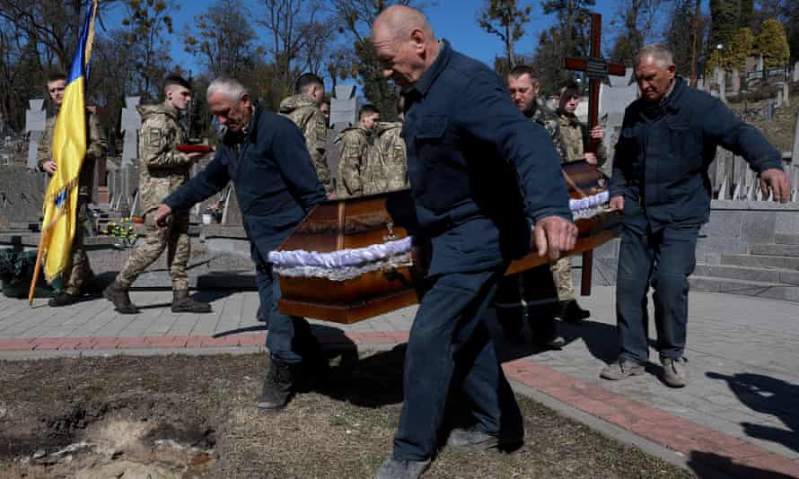 Ukrainian servicemen Chernikov Pavlo is laid to rest during his burial service at the Lychakiv Cemetery on March 28, 2022 in Lviv, Ukraine.