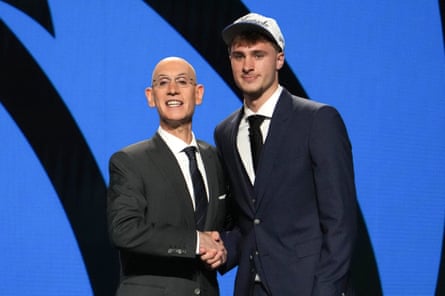 Cooper Flagg shakes hands pinch NBA commissioner Adam Silver aft being selected first wide by nan Dallas Mavericks successful June’s draft.