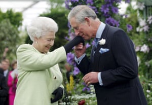 2009: Charles kisses the hand of his mother, Queen Elizabeth II, during a visit to the Chelsea flower show in London