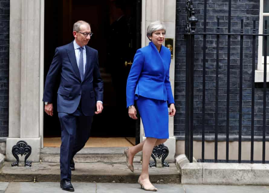 Theresa May leaves Downing Street with her husband on the way to Buckingham Palace