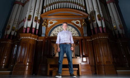 David Pipe, cathedral organist at the Diocese of Leeds, in front of a pipe organ