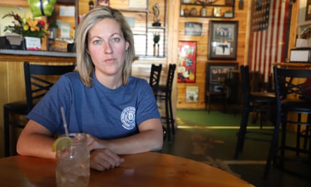 Hannah Gariepy sips glass after glass of water at Alec’s Sports Bar in Jesup, Georgia. It’s all she can afford as a federal prison employee during the shutdown, she says.