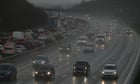 Sinkholes force M25 to close as downpours spark more UK flood warnings