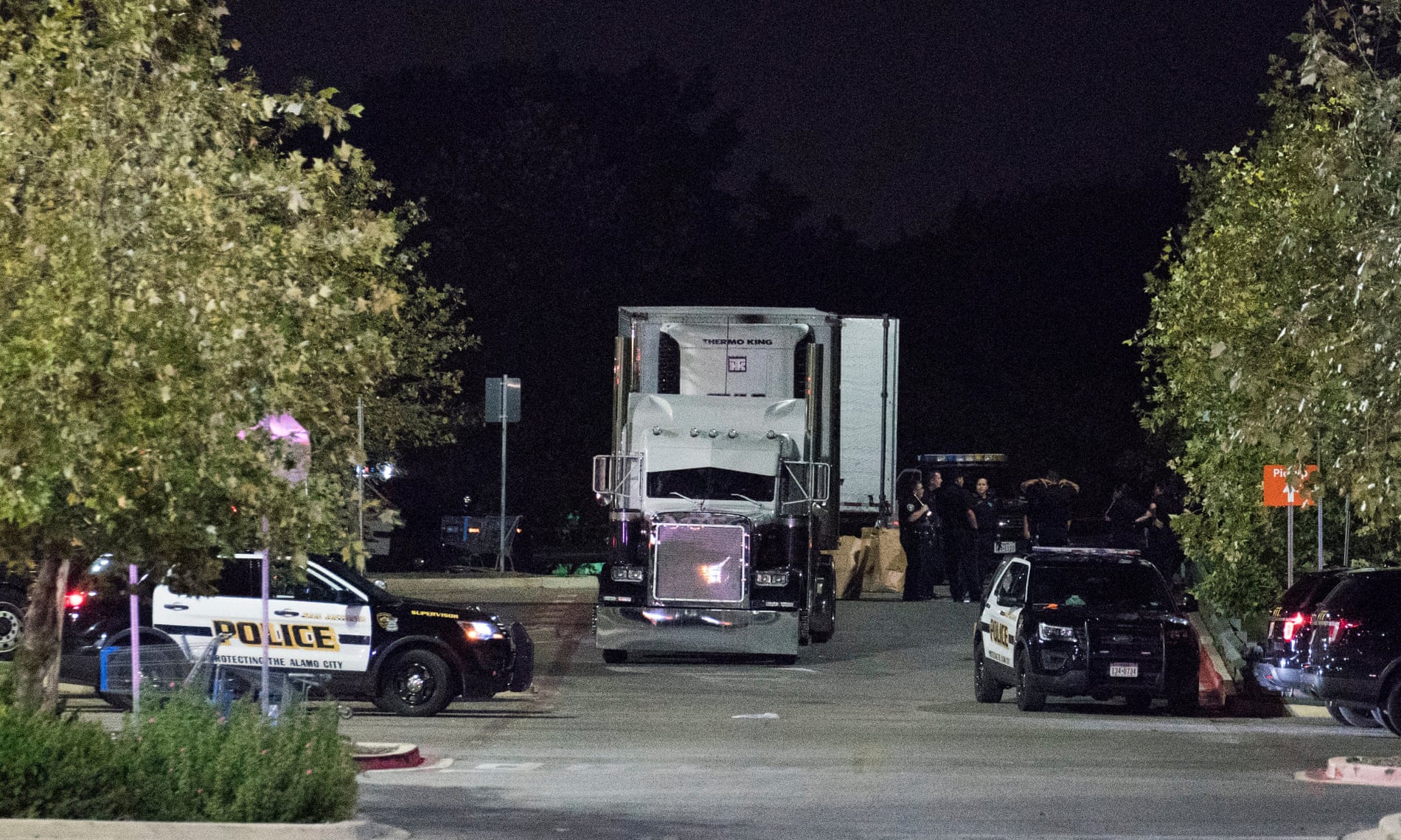 The truck was found in a Walmart parking lot in San Antonio. As many as a hundred people from Mexico and Central America had been crammed inside.
