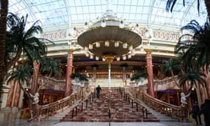 Stock markets tumble as Ryanair and RBS warn on coronavirus damage – business live 2 A shopper walks through a near-deserted Intu Trafford Centre shopping mall amidst the novel coronavirus Covid-19 pandemic.