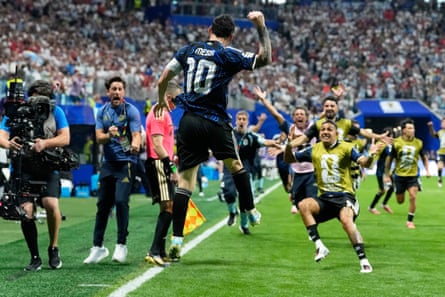 Lionel Messi celebrates after providing the cross for Lautaro Martínez to score Argentina’s winner