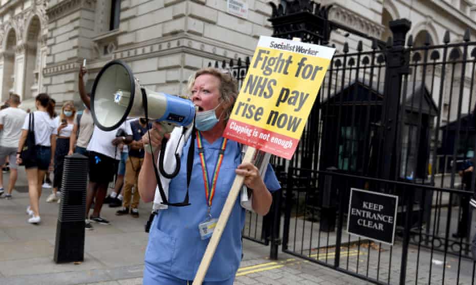 A nurse protesting in front of Downing Street.