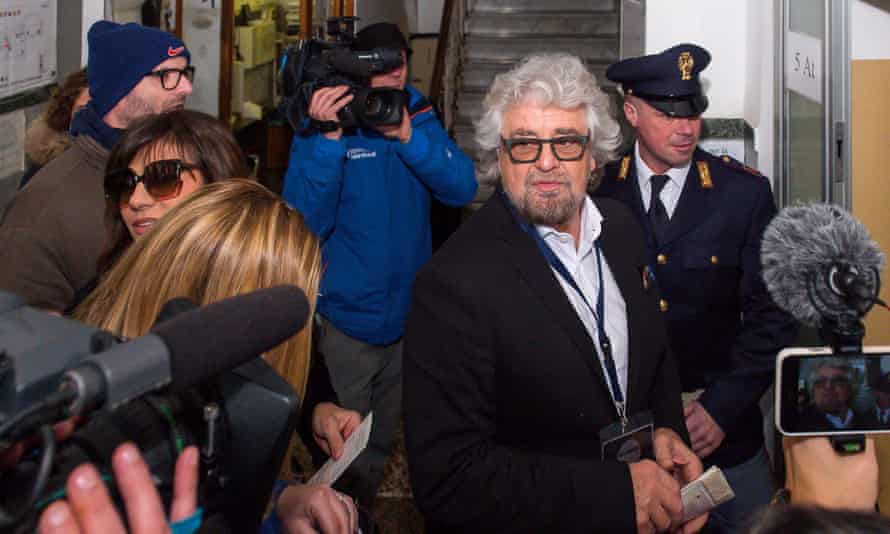 Beppe Grillo arrives at a polling station in Genoa to cast his vote in the Italian general election on Sunday.