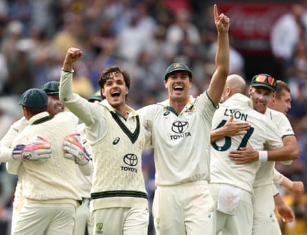Konstas and Pat Cummins celebrate winning the Boxing Day Test against India at the MCG.