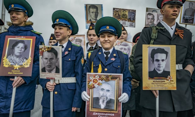 Children hold photos of relatives killed in the Second World War during last May’s march for the ‘immortal regiment’ in Moscow.