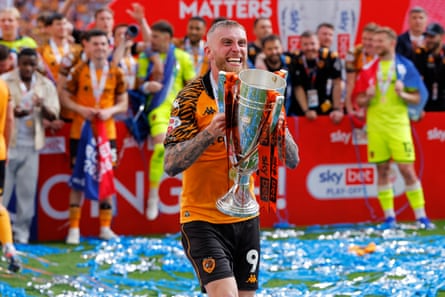 Ollie McBurnie celebrates with the trophy