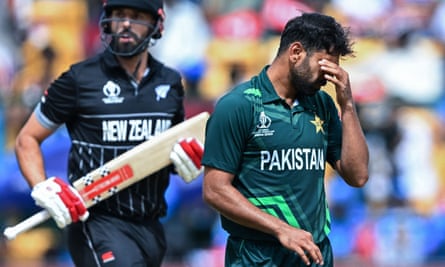 Pakistan bowler Haris Rauf reacts while New Zealand’s Daryl Mitchell takes a run