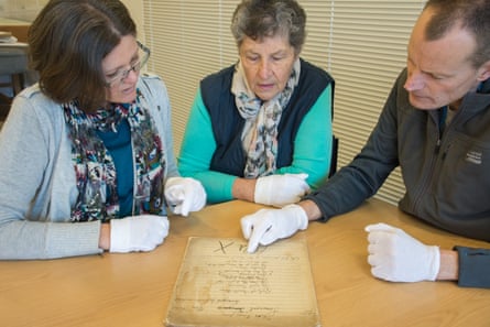 Bronya Dean, Gloria Pheasant and Justus Rozemond examine the score of Folk Songs From Somerset.