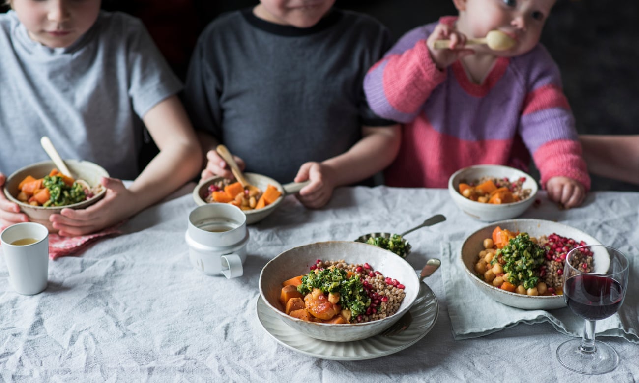a child friendly tagine recipe being eaten at the dinner table by three children