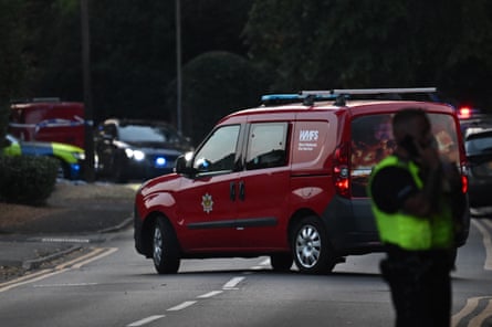 A West Midlands fire service van at the site of the wildfire in Stourbridge with an emergency worker on the phone