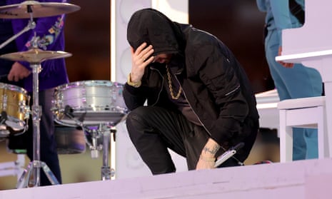 Eminem kneels during his Super Bowl halftime show performance