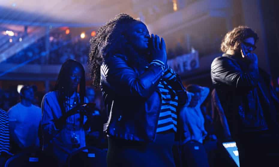 People pray during a service at Hillsong Church in New York