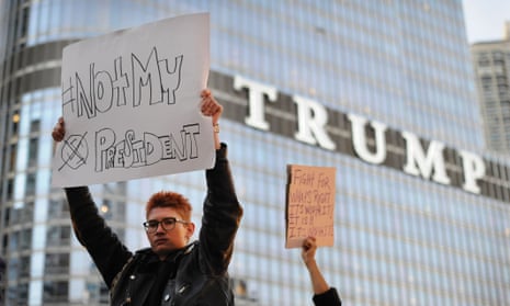 People take part in a protest near the Trump tower, against President-elect Donald Trump, in Chicago, Illinois on November 9, 2016. 