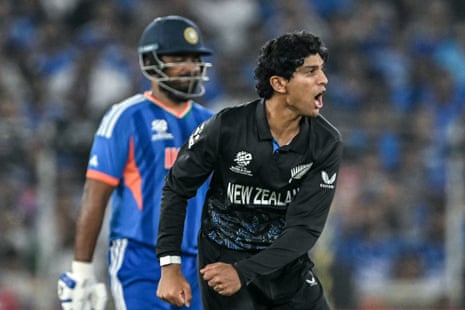 Rachin Ravindra celebrates after taking the wicket of Abhishek.