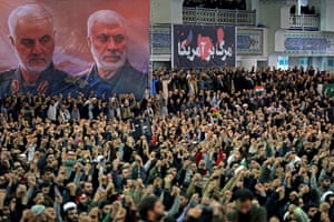A poster shows the late Iranian military commander Qassem Suleimani and the late Iraqi militia commander Abu Mahdi al-Muhandis during Friday prayers in Tehran