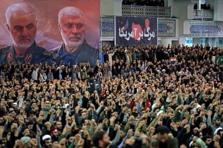 A poster shows the late Iranian military commander Qassem Suleimani and the late Iraqi militia commander Abu Mahdi al-Muhandis during Friday prayers in Tehran
