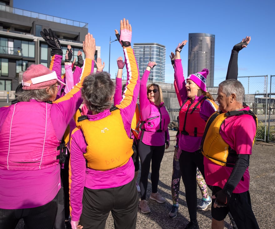 Breast cancer survivors enjoy the camaraderie of a group of dragon boats.