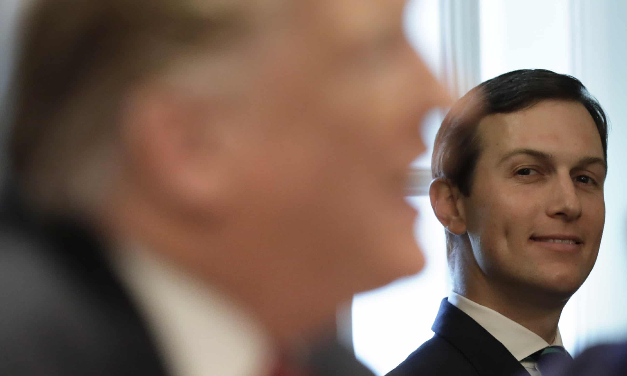 Jared Kushner looks at Donald Trump during a cabinet meeting in February.