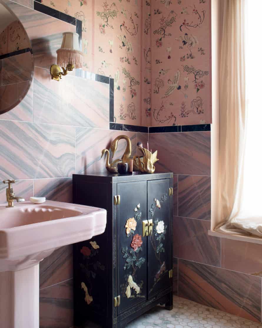 No need to splash out: reclaimed gold swan-head taps in the pink bathroom.