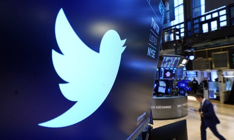 The logo for Twitter appears above a trading post on the floor of the New York Stock Exchange