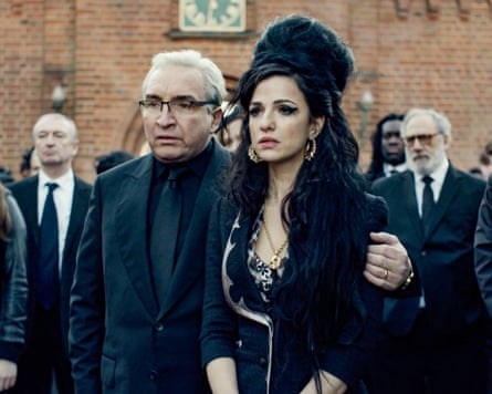 Eddie Marsan and Marisa Abela portraying Mitch and Amy Winehouse in a funeral scene in the film Back to Black