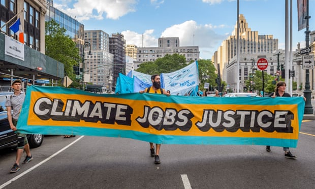 Activist groups and concerned citizens march to New York City Hall in protest of Trump’s attack on the Paris climate agreement in June 2017.