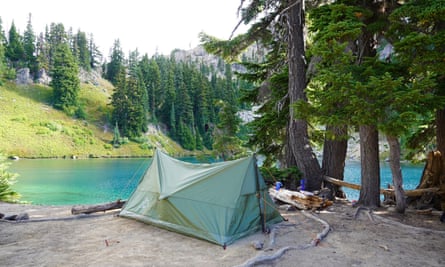 A lightweight tent pitched by the lake.